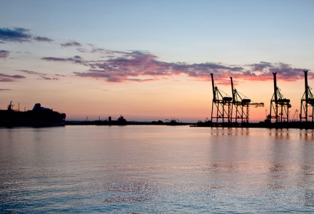 Dusk in the port of Limassol, with the cranes and some shadowy ships moored